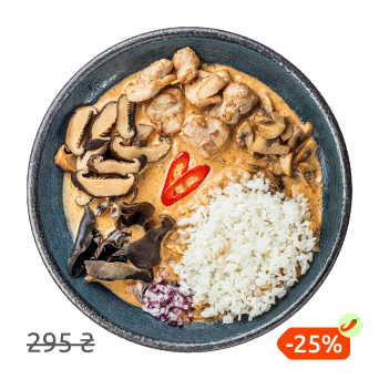 Soup Tom Yam with mushrooms, chicken and stewed rice